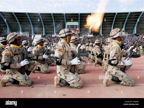 Iraqi Soldiers Fire Their Weapons During The Iraqi Army Day Celebration