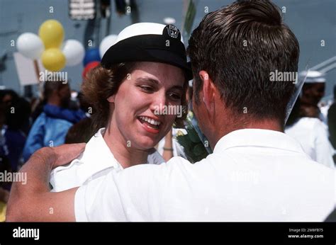 A Sailor From The Destroyer Tender Uss Acadia Ad Is Greeted By One