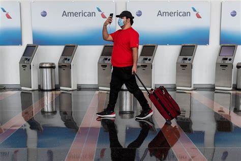 American Airlines Rolls Out Touchless Bag Check But Is Still Booking