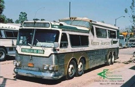 An Old Bus Is Parked On The Side Of The Road In Front Of Other Buses