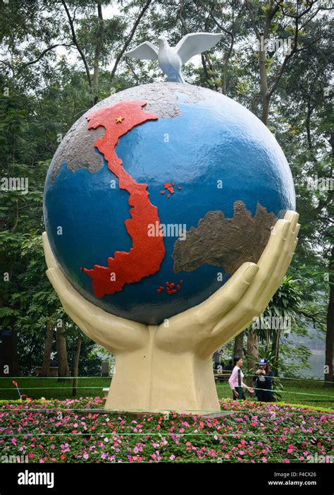 Vietnam Hanoi Sculpture Of Hands Holding Giant Globe With Dove