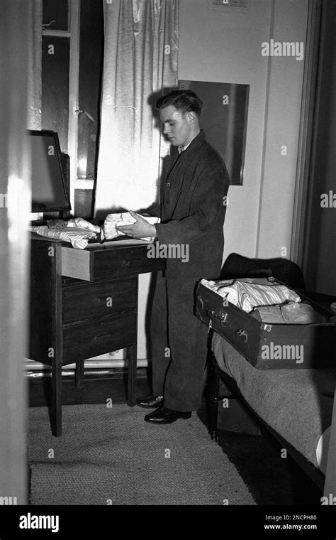 Bryn Jones From Port Talbot Unpacks In His Cubicle In A Hostel Built To