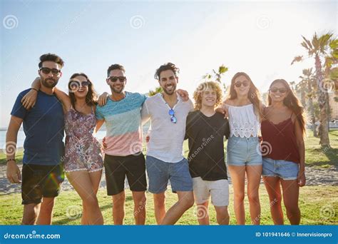 Happy Group Of Friends Standing Together Outside Stock Photo Image Of