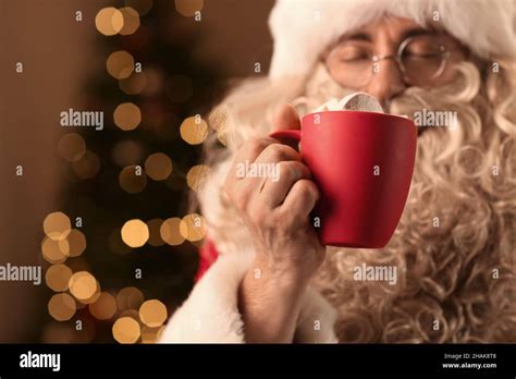 Santa Claus Holding Cup Of Hot Cocoa With Marshmallows In Room On Christmas Eve Closeup Stock