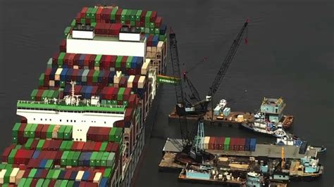 Salvage Crews Offloading Containers From Ship Stuck In Chesapeake Bay