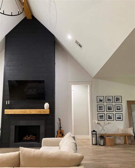 This Living Room With White Cathedral Ceilings Boasts A Dark Gray Tile