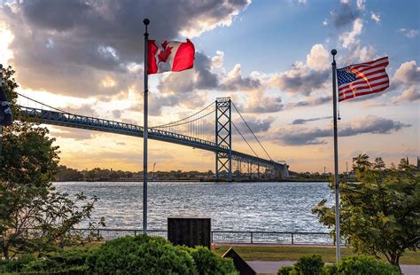 Download Ambassador Bridge Sunset Flags Wallpaper | Wallpapers.com