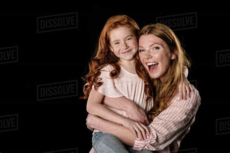 Beautiful Redhead Mother And Daughter Having Fun Together Isolated On