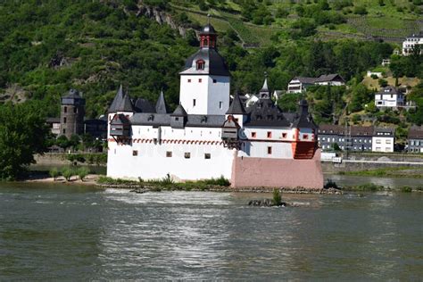 Kaub, Germany - 06 14 2021: Burg Pfalzgrafenstein in the Rhine and City Walls Tower of Kaub ...