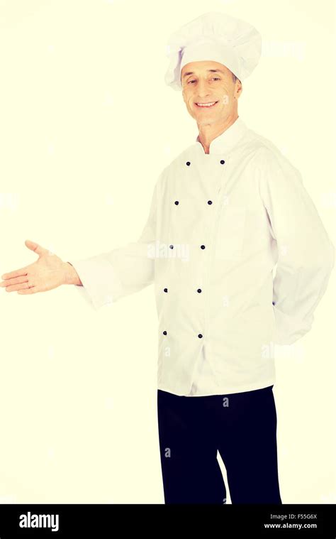 Happy Mature Chef With Welcome Gesture Stock Photo Alamy