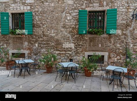 Restaurant Tables At A Narrow Street In The Old Town Of Sibenik