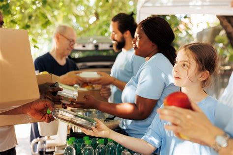 Premium Photo Food Drive Volunteers Helping Needy