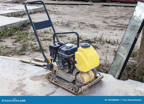 Vibratory Rammer With Vibrating Plate On A Construction Site