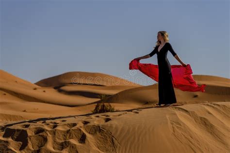 A Beautiful Model Poses Nude Outdoors In The Mountains Of Morocco Stock