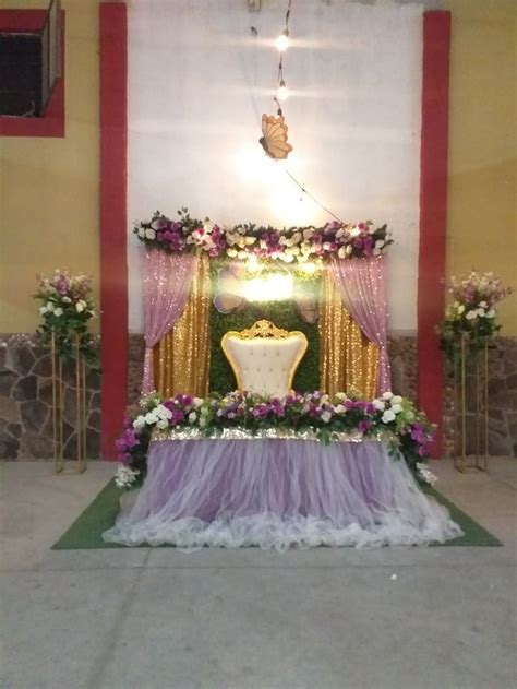 The Altar Is Decorated With Purple And White Flowers Greenery And