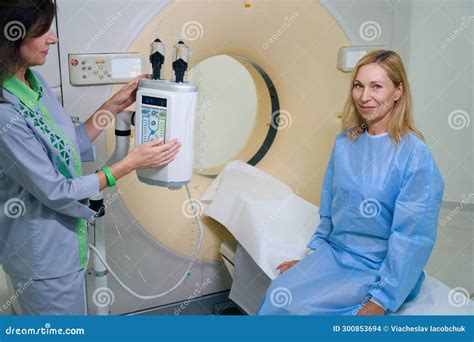 Radiographer Involved In Preparation Of Female Patient For Contrast