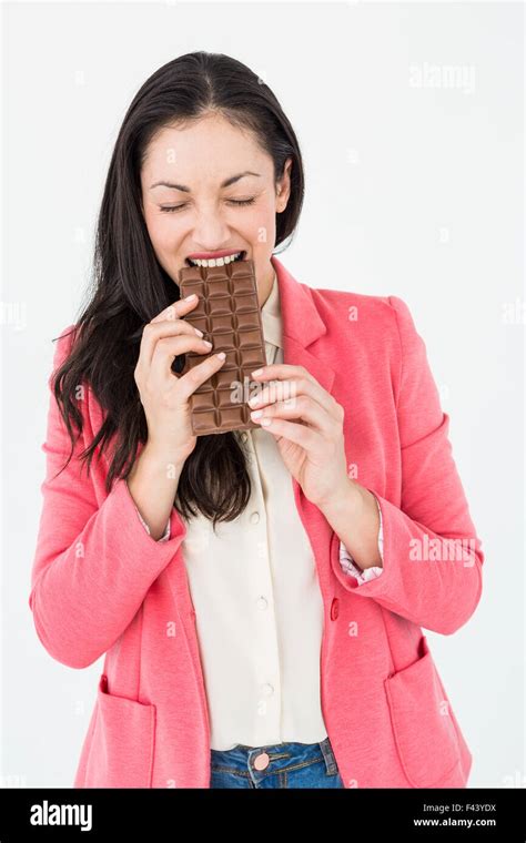 Smiling Brunette Biting Bar Of Chocolate Stock Photo Alamy