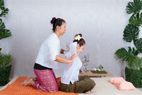 Premium Photo Asian Woman Getting Traditional Thai Stretching Massage