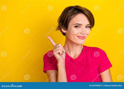 Photo Of Cheerful Positive Lady Wear Pink T Shirt Pointing Empty Space Isolated Yellow Color