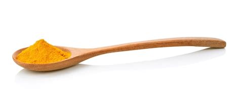 Premium Photo Turmeric Powder In A Wooden Spoon On A White Isolated