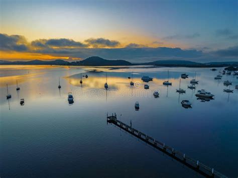 Soft And Hazy Aerial Sunrise Waterscape With Boats Stock Image Image