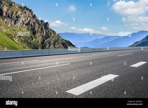 Empty Asphalt Road And Mountain Nature Scenery Under Blue Sky Road And