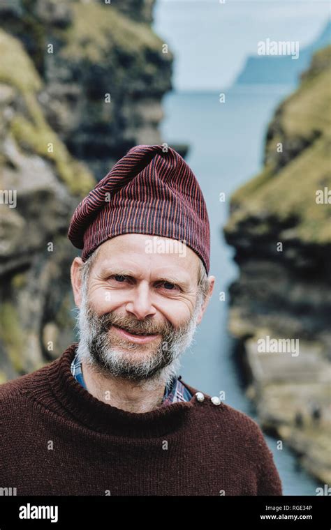 A Faroe Islander Wearing A Traditional Faroese Wool Sweater And Hat In