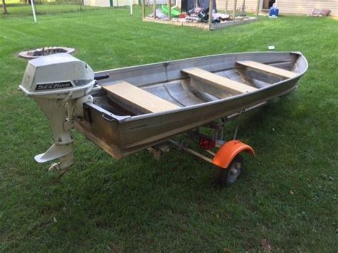 14 Foot Standard Aluminum Boat With Rebuilt Motor Seats And Trailer