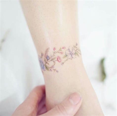 Flower Bracelet Tattoo | Tattoos for daughters, Flower wrist tattoos ...