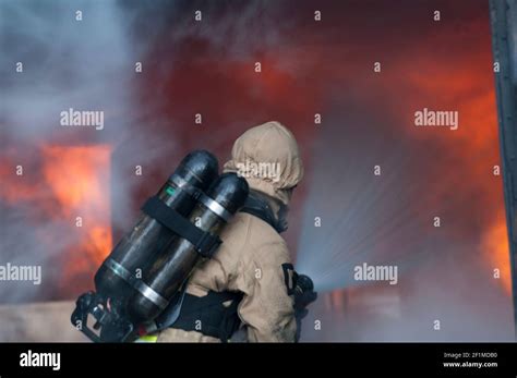 Fireman Holding Water Hose Hi Res Stock Photography And Images Alamy