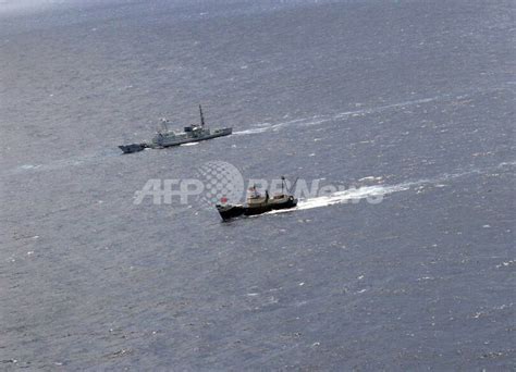 魚釣島上陸の香港活動家5人を逮捕、尖閣諸島 写真2枚 国際ニュース：afpbb News