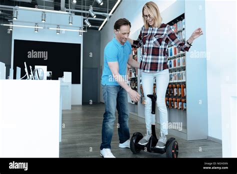 Attentive Brunette Male Helping His Client Stock Photo Alamy