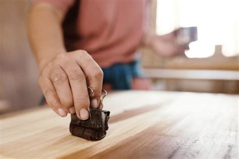 Premium Photo Close Up Image Of Carpenter Using Binder Clip With