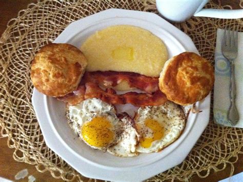 Fried Eggs Sunnyside Up Bacon Cheese Grits And Biscuits Cheese Grits Bacon Cheese Yellow