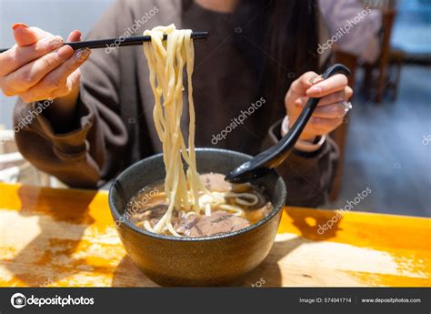 Woman Enjoy Her Taiwan Braised Beef Noodle Soup Stock Photo