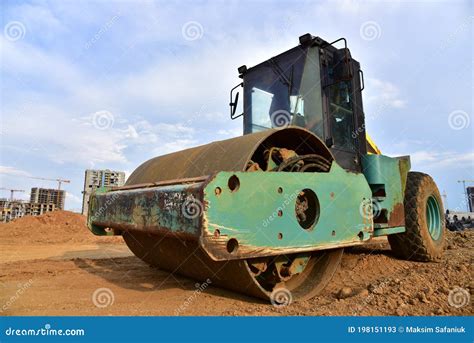 Vibro Roller Soil Compactor Leveling Soil At Construction Site