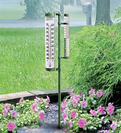 Acurite™ Rain Gauge And Thermometer On Pole Wind And Weather