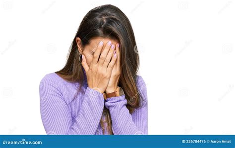 Young Hispanic Woman Wearing Casual Clothes With Sad Expression