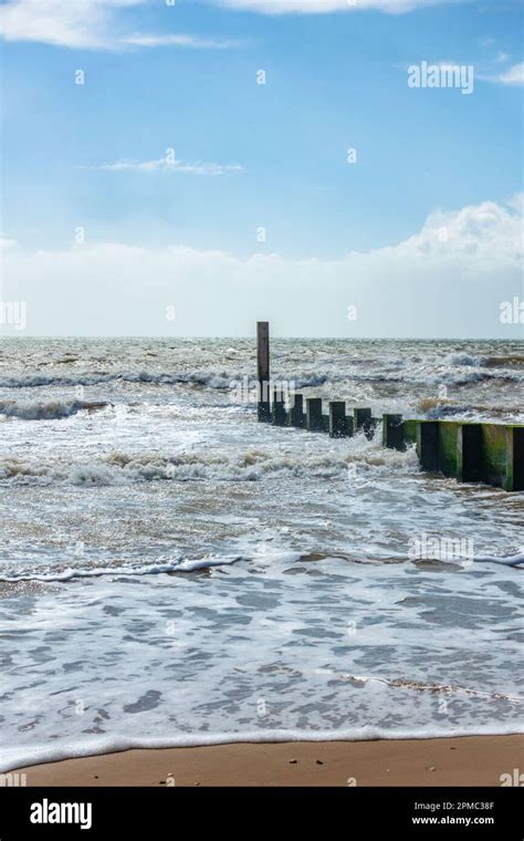 A Groyne Reaching Out Into The Sea Perpendicular To The Shoreline On