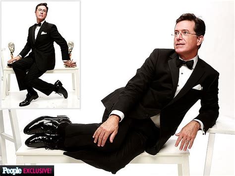 Stephen Colbert posing with his Emmy awards : pics