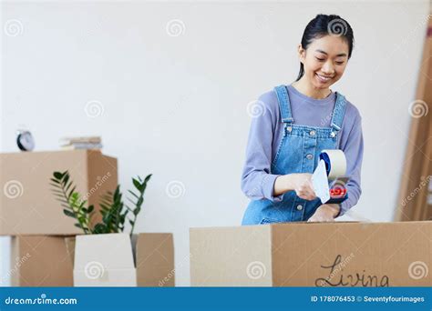 Young Asian Woman Packing Boxes For Moving Stock Image Image Of