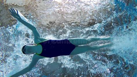 Swimmer Girl Swims Butterfly Swimming Style In The Pool Slow Motion