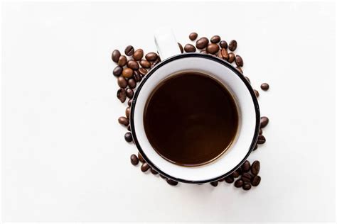 Smiling face - with coffee beans mouth and eyes from two paper cups of ...