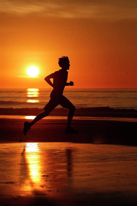 Silhouette Of Runner At Sunset On La 4 Photograph By Kc Alfred