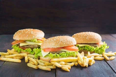 Delicious Hamburger With French Fries On Wood Stock Photo Image Of