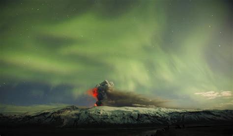 The Eyjafjallajokull Volcano Erupts In 2010 With A Stunning Display Of The Northern Lights In