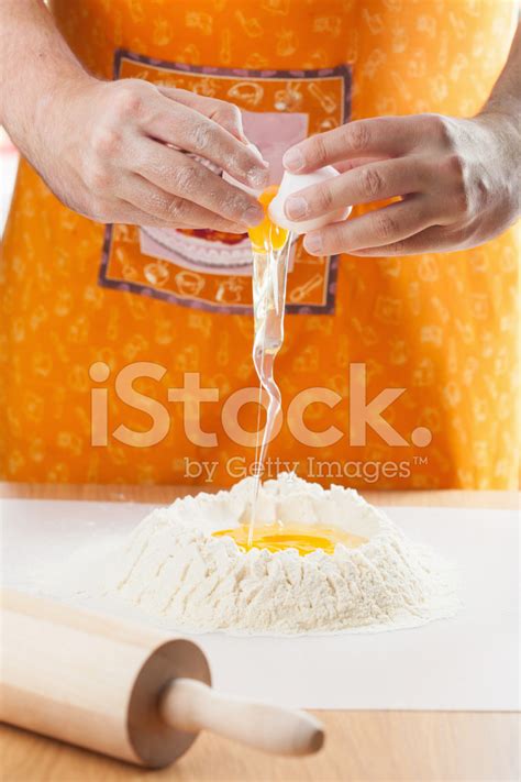 Man Hands Cracking Egg Into Flour Stock Photo Royalty Free Freeimages