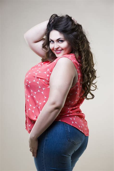 Happy Plus Size Fashion Model Fat Woman On Beige Background Stock