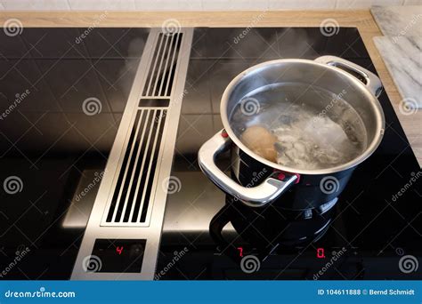 Cooking Pot With Boiling Water And Eggs On A Induction Stove Stock