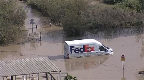 FedEx driver escapes flooding waters after truck gets stuck in Tijuana ...